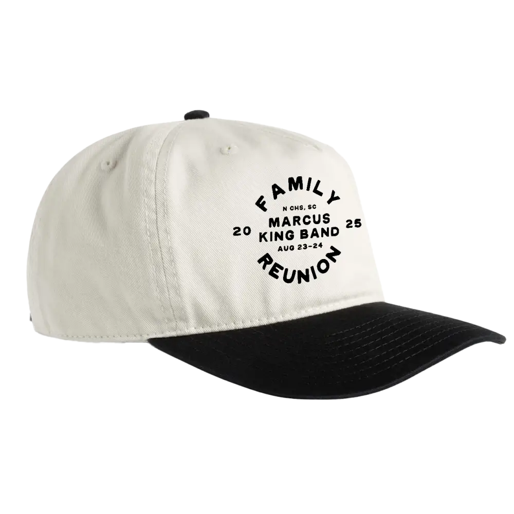 Off-white and black two-tone baseball cap with a curved brim, featuring embroidered text that reads ’family marcus king band reunion’ in an arched design.
