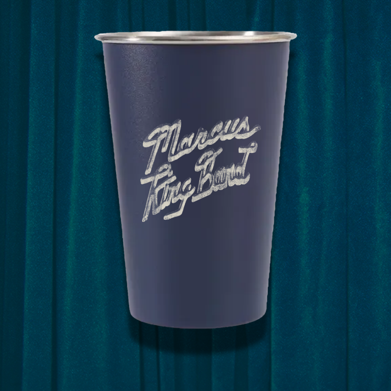 Purple cup with white text on a dark blue curtain background