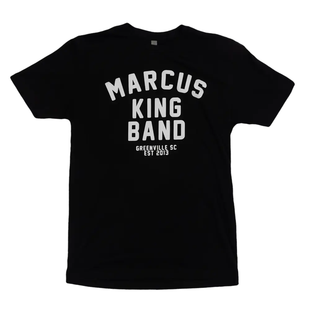 Black t-shirt with white text reading ’MARCUS KING BAND GREENVILLE SC EST 2013’’.