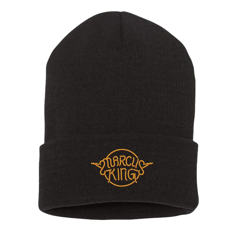 Black knit beanie with a yellow embroidered logo reading ’Marcus King’.