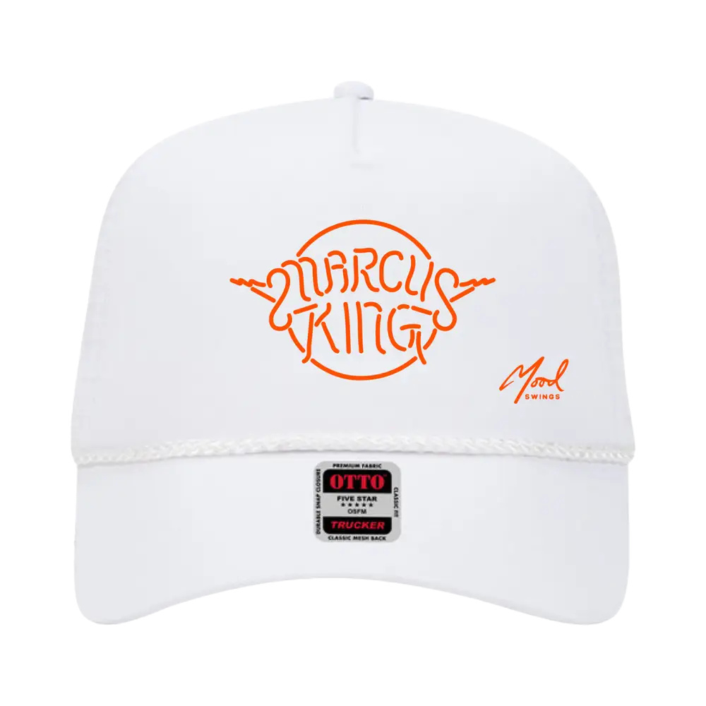 White baseball cap with orange ’MARCUS KING’ logo on the front.