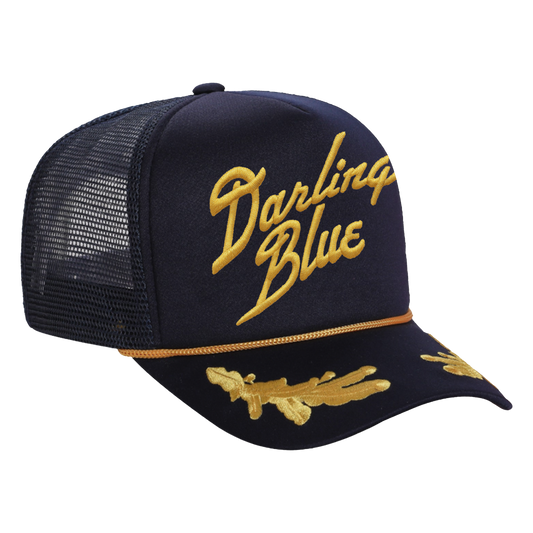 Navy blue cap with gold mesh and 'Darling Blue' text on a white background