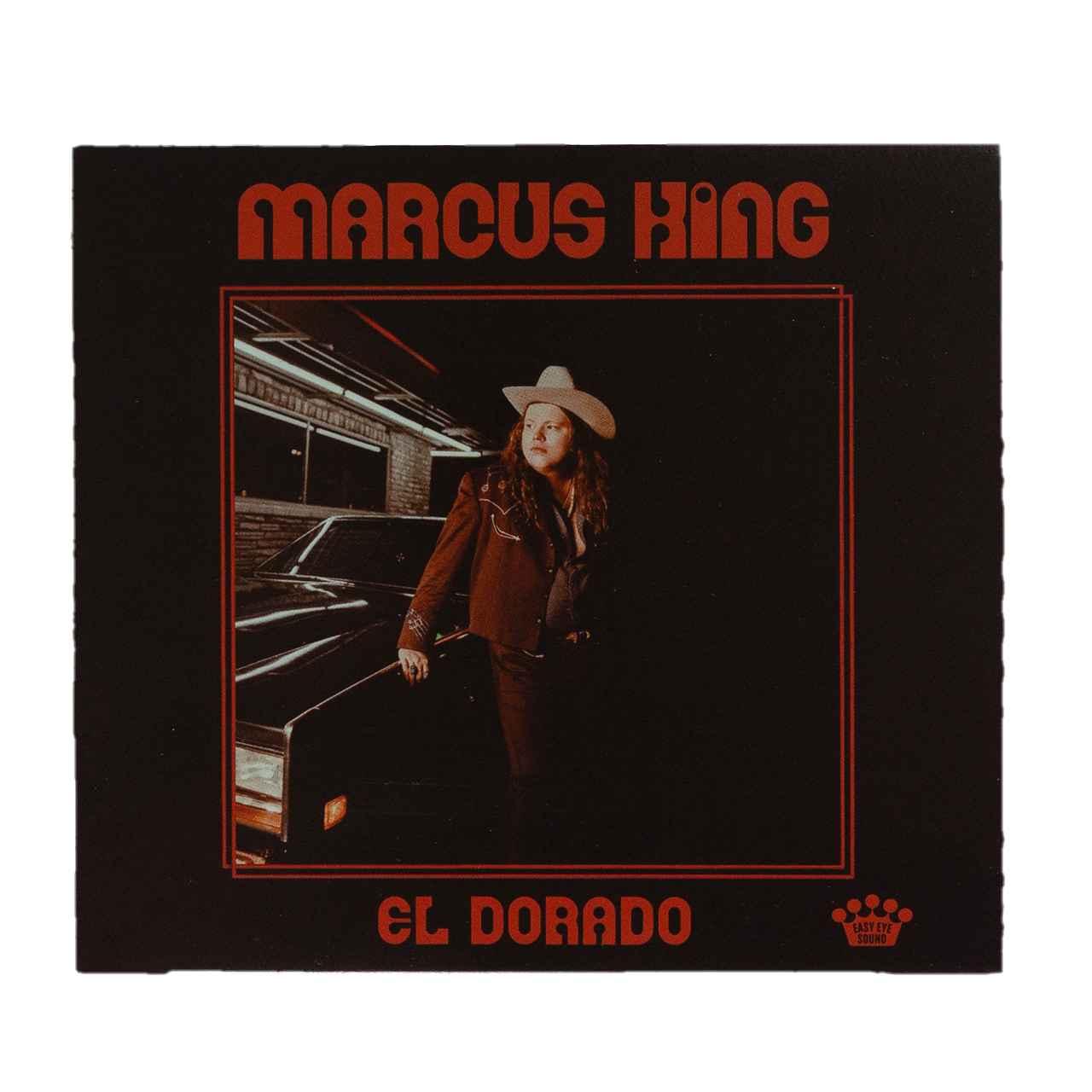 Album cover featuring a person in a cowboy hat and red suit standing next to a car.