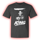 Dark gray t-shirt featuring a black and white graphic design of a man wearing a hat with the word ’KING’ below.