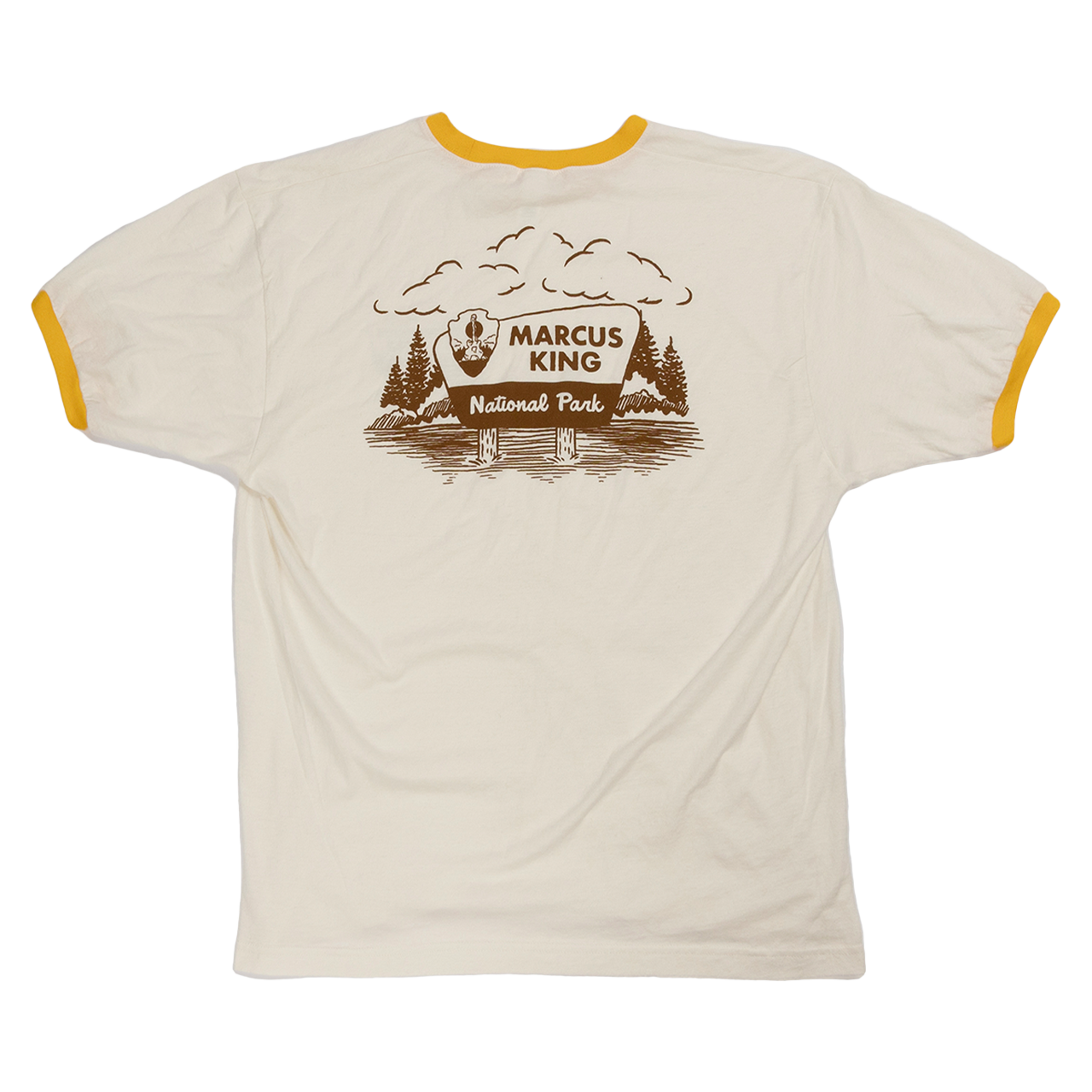 T-shirt with a national park-themed graphic design featuring trees, mountains, and the text ’Marcus King National Park’.