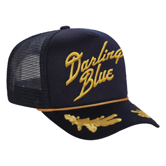 Navy blue cap with gold mesh and 'Darling Blue' text on a white background