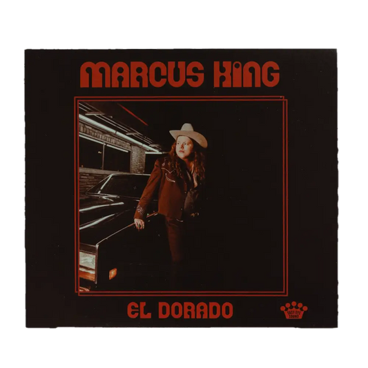 Album cover featuring a person in a cowboy hat and red suit standing next to a car.