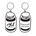 Two keychain pendants shaped like pill bottles labeled ’Mood Swings’.