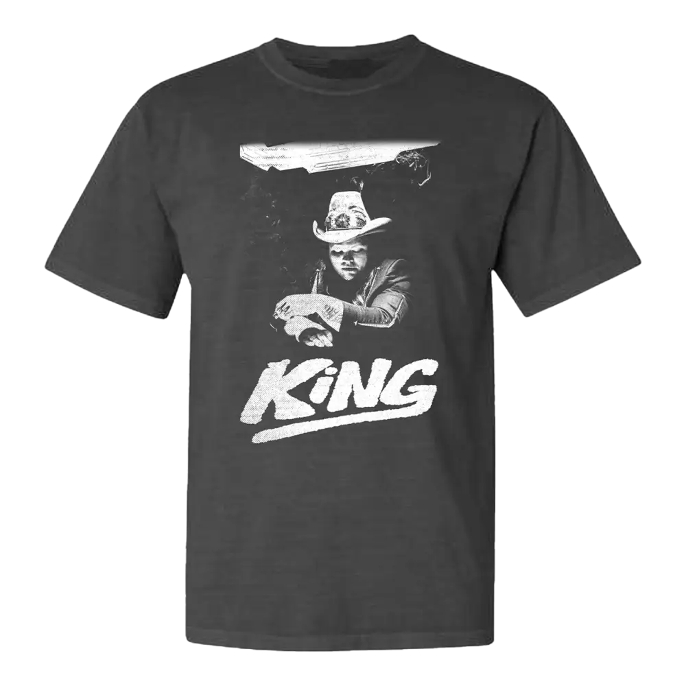 Dark gray t-shirt featuring a black and white graphic design of a cowboy figure with the word ’KING’ below.