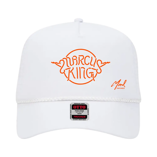 White baseball cap with orange ’MARCUS KING’ logo on the front.