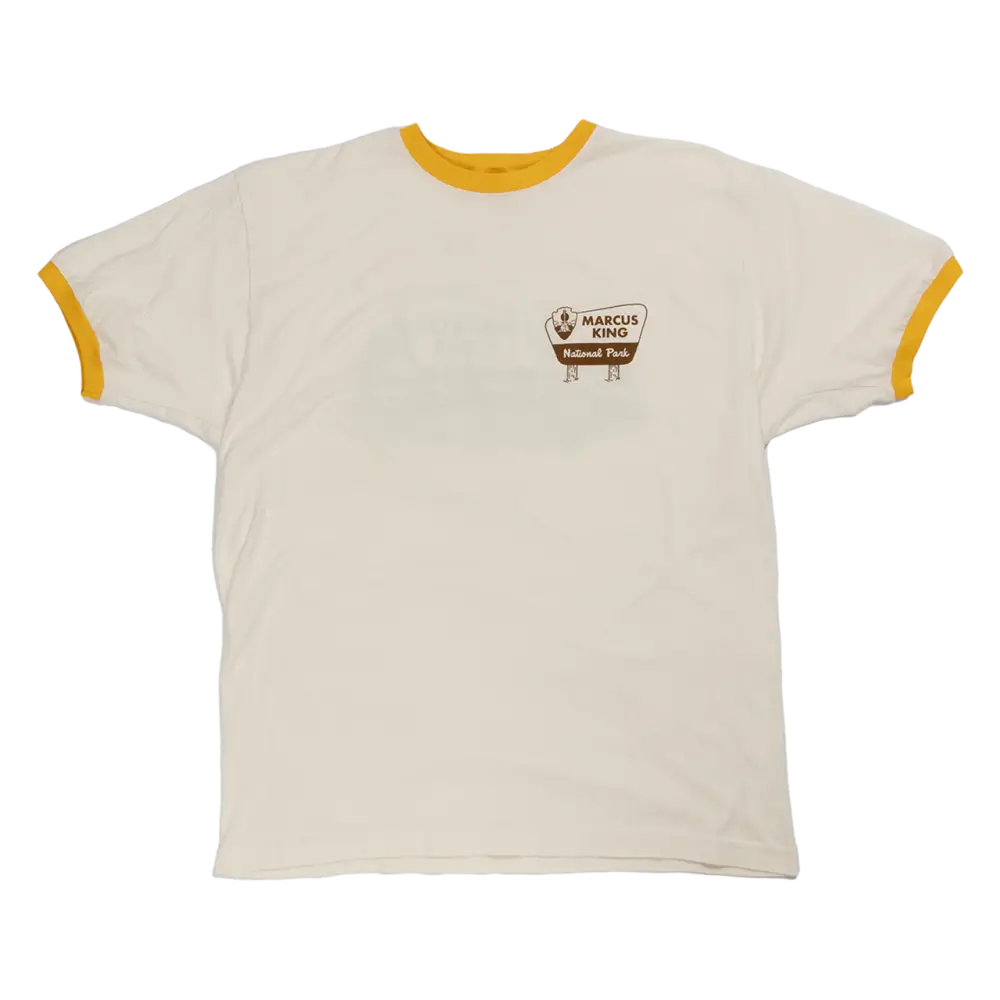 White t-shirt with yellow trim and a small logo on the chest.
